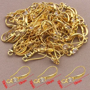 Detailed view of copper-plated 18k gold earring hooks with cubic zirconia, 19mm x 10mm