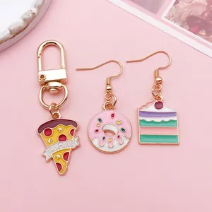 Macro detail of colorful enamel donut cake and pizza charms for DIY jewelry making