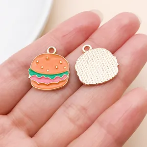 Close-up of a hamburger enamel charm with detailed front and back for DIY jewelry.