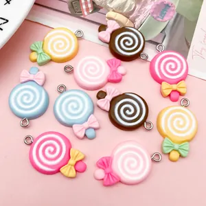 Detailed view of colorful resin lollipop charms with bows for DIY jewelry accessories