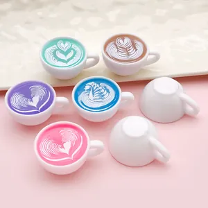 Detail view of miniature resin coffee cups with colorful heart latte art patterns