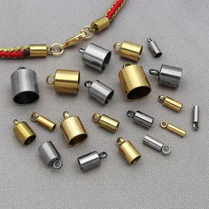 Macro detail of various stainless steel tassel end caps in gold and silver finishes