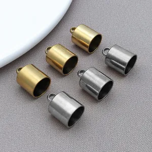 Detailed view of gold and silver stainless steel tassel end caps for DIY jewelry making