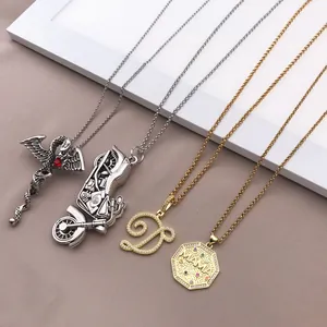 Detailed view of assorted stainless steel necklaces with motorcycle, letter D, and MAMA pendants