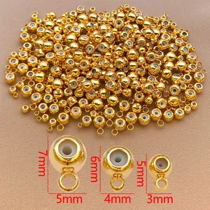 Vista detallada de cuentas espaciadoras doradas con núcleo de silicona de 3mm, 4mm y 5mm.