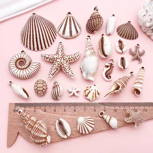 Varios dijes de acrílico con forma de concha y estrella de mar para joyería DIY con regla