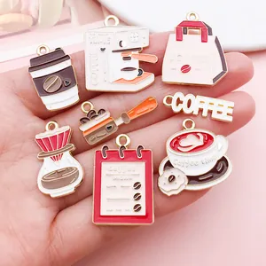 Detailed view of coffee-themed enamel alloy charms featuring machine and cup designs