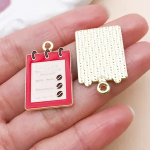 Detailed macro view of the front and back of coffee menu enamel charms for DIY crafts