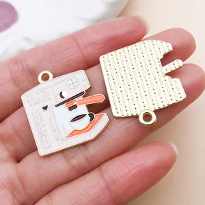 Detailed front and back view of pink enamel coffee machine charm for DIY jewelry