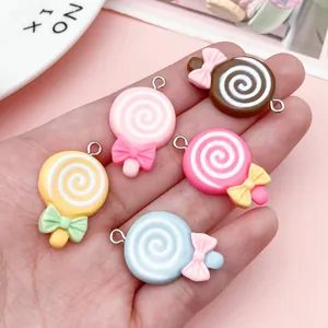 Detailed view of mixed five-color bow lollipop resin charms for DIY jewelry making