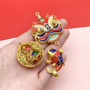 Detailed view of traditional Chinese gold enamel lion, gourd and koi fish charms