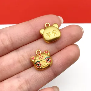 Detailed macro shot of golden lucky cat enamel charms for DIY necklace jewelry making
