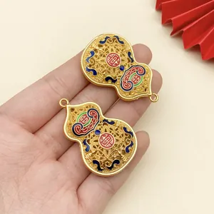 Detailed view of gold enamel hulu pendants with traditional patterns and Lu character.