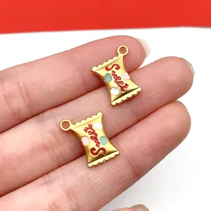 Macro view of gold-plated candy bag charms with red Sweet text and colorful hearts