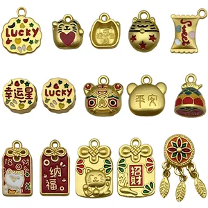 Collection of gold-plated lucky cat and fortune star enamel charms for DIY jewelry making.