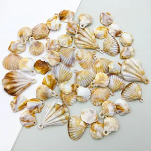 Detail view of assorted acrylic scallop shell pendants for DIY jewelry and craft projects