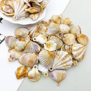 Detailed macro view of assorted acrylic scallop shell charms for DIY jewelry and wind chimes