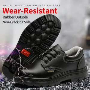 Detailed view of black leather insulated safety shoes featuring durable rubber outsoles