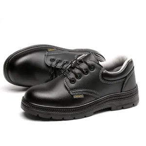 Detailed macro view of black leather safety work shoes with heavy duty anti-smashing soles
