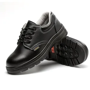 Detail showing the side and anti-slip sole of black leather safety shoes with reinforced toe