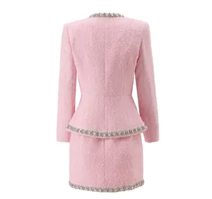 Back view of elegant pink tweed jacket and skirt set with crystal trim