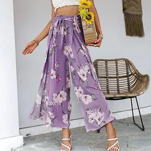 Stylish floral high-waisted wide-leg trousers with side slits in elegant lavender purple