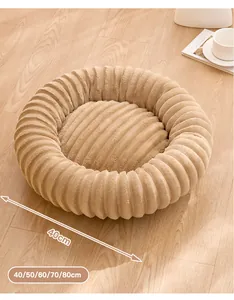 Detailed view of a soft plush round dog bed with available size dimensions 40-80cm