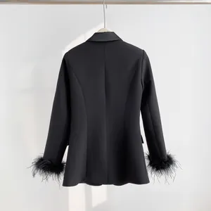 Rear view of a black casual blazer with elegant feather trim on the cuffs.