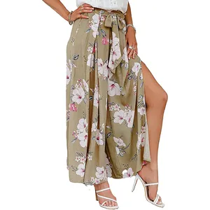 Detailed side view of floral high-waisted wide-leg trousers featuring a stylish side slit