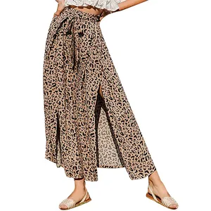 Detailed view of high-waisted leopard print wide-leg pants with stylish side slits