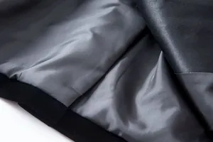 Close-up detail showing the smooth inner lining and black velvet fabric of the blazer