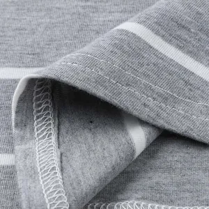 Detailed macro view showing the high-quality stitching and striped jersey fabric texture