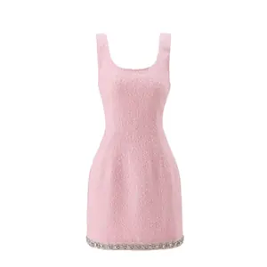 Elegant pink tweed sleeveless mini dress with rhinestone-embellished hem line