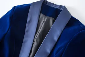 Detail view of premium royal blue velvet blazer featuring an elegant satin shawl collar