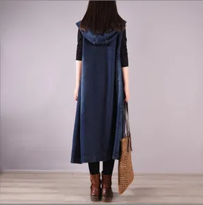 Detailed back view of a long hooded denim sleeveless dress in an artistic loose fit