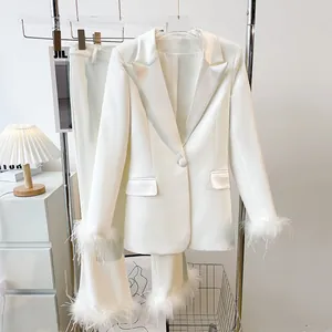 Elegant white two-piece suit set with faux fur trim blazer and matching trousers