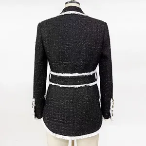 Back view of an elegant black tweed jacket with white fringe trim and slim waist belt design