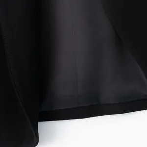 Detailed view of the high-quality inner lining and seam of a black women's blazer