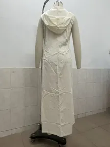 Rear view of a minimalist sleeveless cream white long hooded dress on mannequin