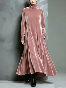 Elegant dusty pink velvet maxi dress with a turtleneck and long sleeves in a studio