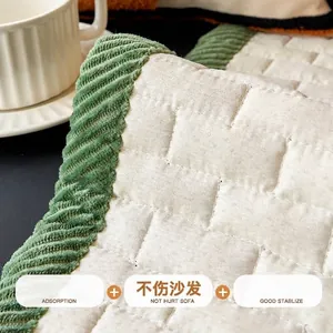 Anti-slip corduroy sofa cover with quilted cream fabric and green ribbed edging