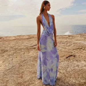 Elegant French style floral maxi dress featuring a deep V-neck and halter design by the sea