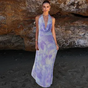 Detailed view of the purple floral halter-neck maxi dress with a deep V-neckline