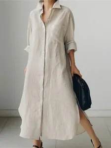 Vista completa de un vestido camisero largo de algodón y lino beige con aberturas