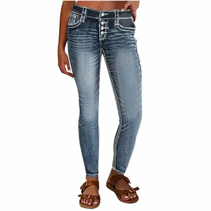 High-quality detail view of slim fit stretch denim jeans with white contrast stitching
