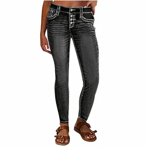 Close-up of slim-fit black denim jeans with white contrast stitching and button fly.