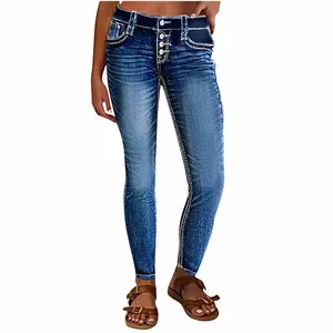 Full length view of women's blue skinny denim jeans with button fly and contrast stitching