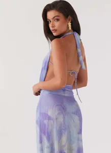 Back view of elegant purple tie-dye halter neck mesh dress with open back design