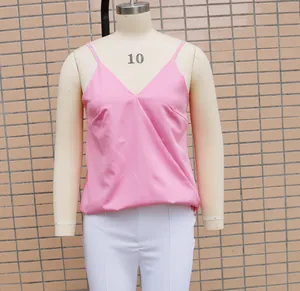 Detailed view of women's pink V-neck satin camisole top displayed on a mannequin stand