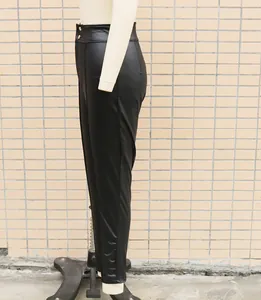 Detailed side profile view of high-waisted black faux leather leggings on a mannequin